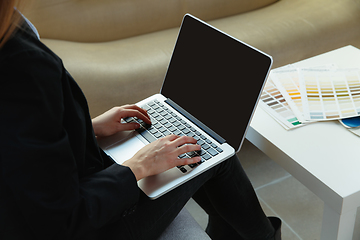 Image showing Interior designer working in modern office. Young business woman in contemporary interior.