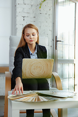 Image showing Interior designer working in modern office. Young business woman in contemporary interior.