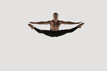 Image showing Modern ballet dancer. Contemporary art ballet. Young flexible athletic man.