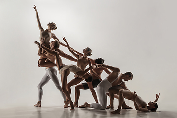 Image showing The group of modern ballet dancers. Contemporary art ballet. Young flexible athletic men and women.