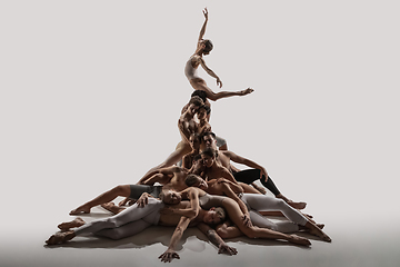 Image showing The group of modern ballet dancers. Contemporary art ballet. Young flexible athletic men and women.