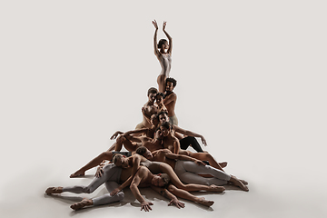 Image showing The group of modern ballet dancers. Contemporary art ballet. Young flexible athletic men and women.