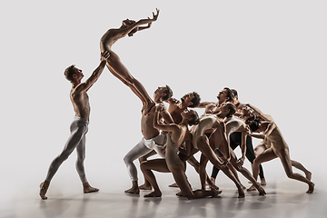 Image showing The group of modern ballet dancers. Contemporary art ballet. Young flexible athletic men and women.