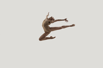 Image showing Modern ballet dancer. Contemporary art ballet. Young flexible athletic woman.