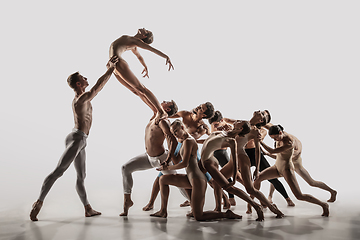 Image showing The group of modern ballet dancers. Contemporary art ballet. Young flexible athletic men and women.