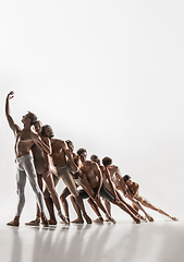 Image showing The group of modern ballet dancers. Contemporary art ballet. Young flexible athletic men and women.