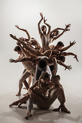 Image showing The group of modern ballet dancers. Contemporary art ballet. Young flexible athletic men and women.