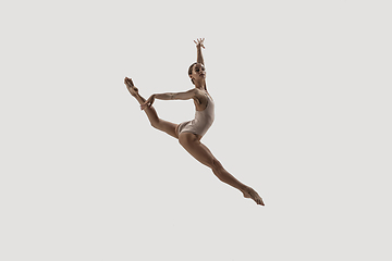 Image showing Modern ballet dancer. Contemporary art ballet. Young flexible athletic woman.