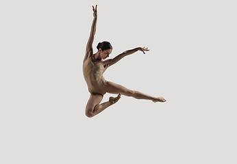 Image showing Modern ballet dancer. Contemporary art ballet. Young flexible athletic woman.