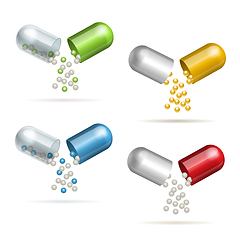 Image showing Set of opening pills. Small balls pouring from an open medical capsules.