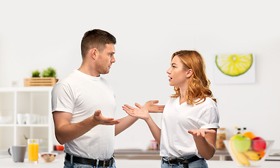 Image showing unhappy couple having argument at kitchen