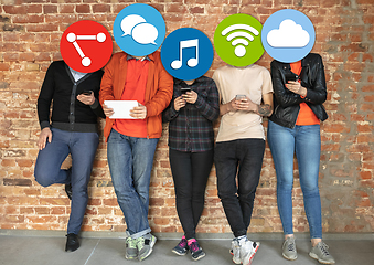 Image showing Creative millenial people connecting and sharing social media. Modern UI icons as heads