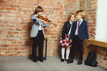 Image showing Group of kids spending time after school together. Handsome frie