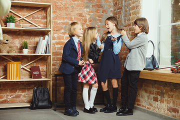 Image showing Group of kids spending time after school together. Handsome frie