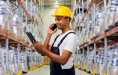 Image showing indian worker calling on smartphone at warehouse