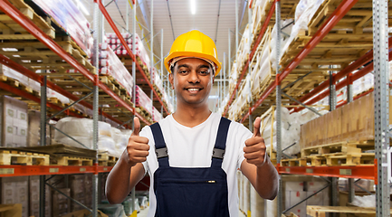 Image showing happy indian worker showing thumbs up at warehouse