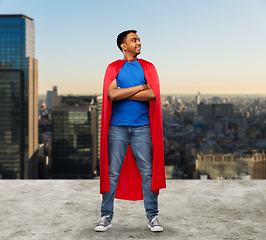 Image showing happy indian man in red superhero cape in tokyo