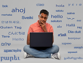 Image showing thinking indian man with laptop computer