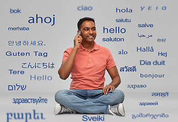 Image showing happy indian man calling on smartphone