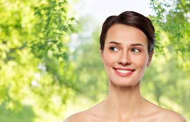 Image showing beautiful smiling young woman with bare shoulder