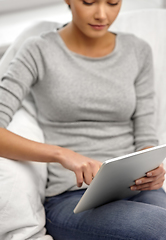 Image showing close up of young woman with tablet computer