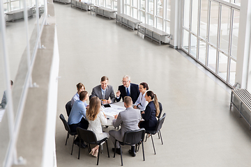 Image showing architects with laptop and blueprint at office