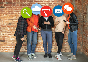 Image showing Creative millenial people connecting and sharing social media. Modern UI icons as heads