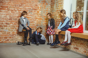 Image showing Group of kids spending time after school together. Handsome frie