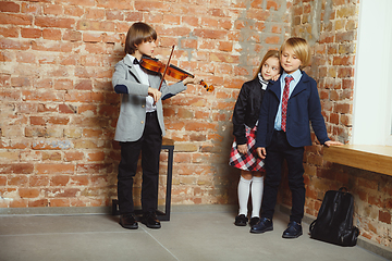 Image showing Group of kids spending time after school together. Handsome frie