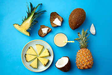 Image showing pineapple, coconut and drink with paper straw