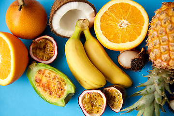 Image showing different exotic fruits on blue background