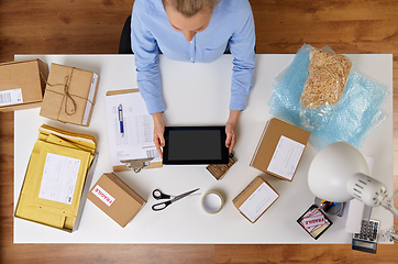 Image showing woman with tablet pc and clipboard at post office