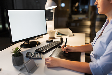 Image showing designer with computer and pen tablet at office