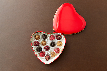 Image showing candies in red heart shaped chocolate box