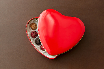 Image showing candies in red heart shaped chocolate box