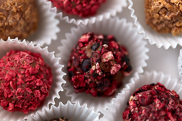 Image showing close up of different candies in paper cups