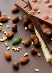 Image showing close up of different chocolate bars and nuts