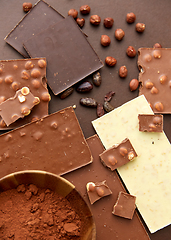 Image showing chocolate with hazelnuts, cocoa beans and powder