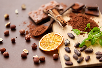 Image showing chocolate with hazelnuts, cocoa beans and orange