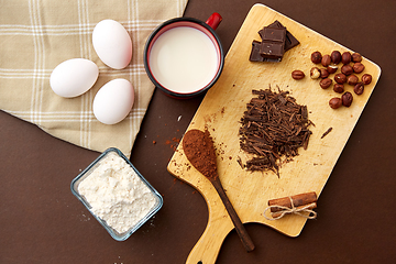 Image showing chocolate, cocoa powder, milk, eggs and flour