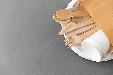 Image showing wooden spoons, forks and knives on paper plate