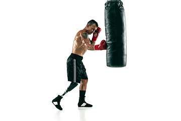 Image showing Full length portrait of muscular sportsman with prosthetic leg, copy space. Male boxer in red gloves.