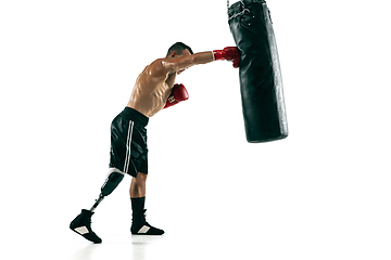 Image showing Full length portrait of muscular sportsman with prosthetic leg, copy space. Male boxer in red gloves.