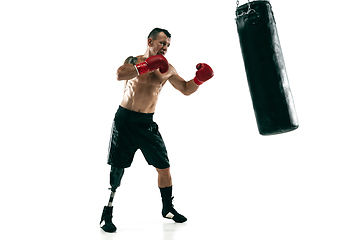 Image showing Full length portrait of muscular sportsman with prosthetic leg, copy space. Male boxer in red gloves.