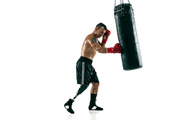 Image showing Full length portrait of muscular sportsman with prosthetic leg, copy space. Male boxer in red gloves.