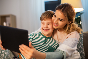 Image showing mother and son using tablet computer at home