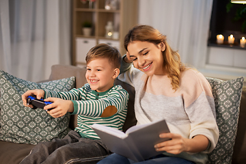 Image showing happy mother with little son spending time at home