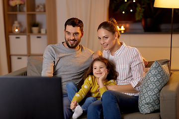 Image showing happy family watching tv at home at night