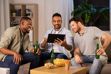 Image showing male friends with tablet pc drinking beer at home