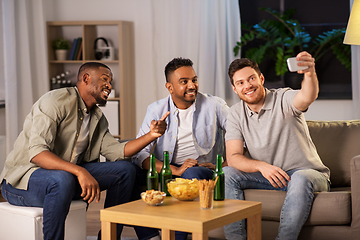 Image showing male friends with smartphone taking selfie at home